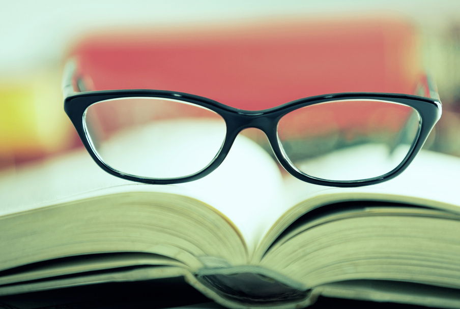 Glasses are laying on a book Cross Prozessed